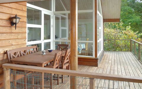 Piia - 800M from the Sea: Flooring, Furniture, Floor, Wood, Wood Flooring, Porch, Hardwood, Wood Stain, Chair, Interior Design