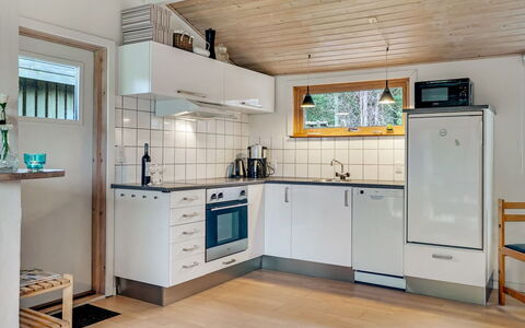 Joosua - 400M from the Sea: Kitchen, Flooring, Major Appliance, Wood, Kitchen Appliance, Interior Design, Countertop, Ceiling, Floor, Cabinetry