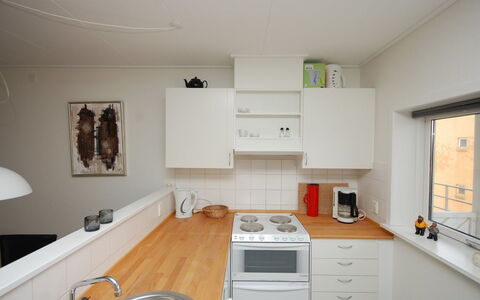 Runhild - 100M from the Sea: Kitchen, Kitchen Appliance, Countertop, Major Appliance, Cabinetry, Interior Design, Flooring, Furniture, Wood, Kitchen Sink