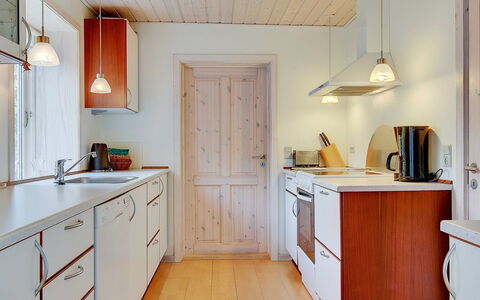Etta - 957M from the Sea: Countertop, Flooring, Interior Design, Wood, Kitchen, Cabinetry, Ceiling, Floor, Light Fixture, Kitchen Appliance