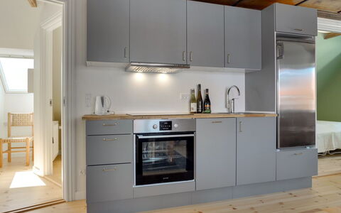Liina - 200M from the Sea: Kitchen, Kitchen Appliance, Flooring, Countertop, Cabinetry, Major Appliance, Wood, Interior Design, Floor, Furniture