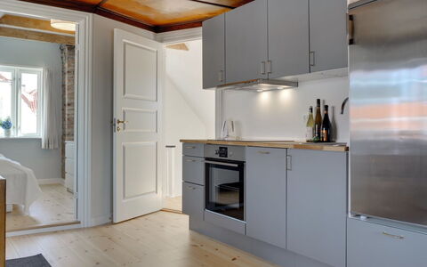Liina - 200M from the Sea: Flooring, Floor, Kitchen, Wood, Interior Design, Ceiling, Countertop, Kitchen Appliance, Major Appliance, Furniture