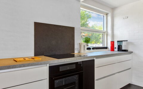 Kælle - 500M from the Sea: Countertop, Kitchen, Flooring, Kitchen Appliance, Wood, Interior Design, Home Appliance, Cabinetry, Major Appliance, Floor