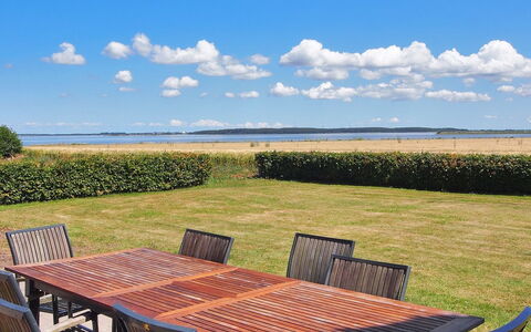 Spase - 250M to the Fjord: Furniture, Outdoor Furniture, Table, Outdoor Table, Chair, Sea, Shade, Coast, Ocean, Lawn