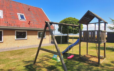Spase - 250M to the Fjord: Playground Slide, Outdoor Play Equipment, Public Space, Human Settlement, Chute, Playground, Shade, Lawn, Yard, Landscaping