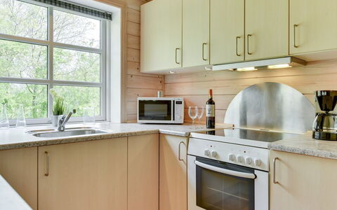Fenja - 500M to the Fjord: Kitchen, Countertop, Kitchen Appliance, Flooring, Wood, Interior Design, Cabinetry, Plumbing Fixture, Floor, Major Appliance