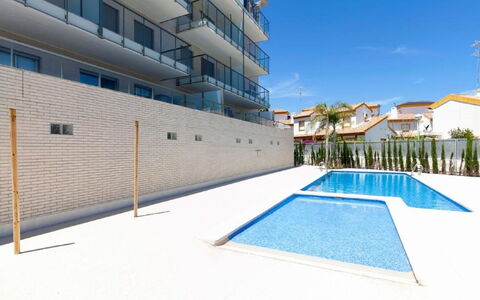 Dunas Plus Penthouse: Building, Daytime, Sky, Plant, Tree, Arecales, Fence, Terrestrial Plant, Urban Design, Woody Plant