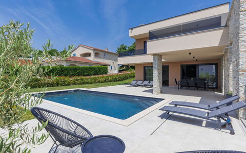 Prudensia: Property, Sky, Water, Swimming Pool, Plant, Azure, Building, Outdoor Furniture, Shade, Chair