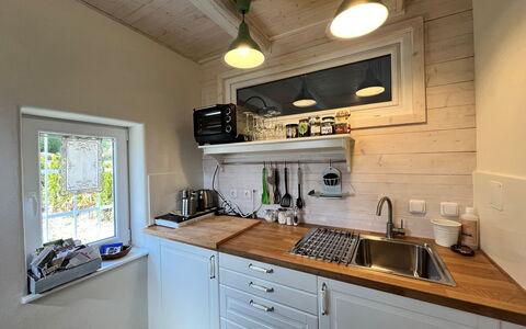 Tiny Lavender House: Countertop, Cabinetry, Property, Kitchen Sink, Sink, Tap, Building, Kitchen, Interior Design, Wood