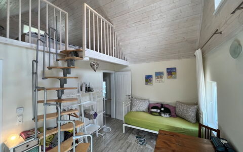 Tiny Lavender House: Property, Wood, Interior Design, Flooring, Floor, Wall, Couch, Comfort, Hardwood, Building