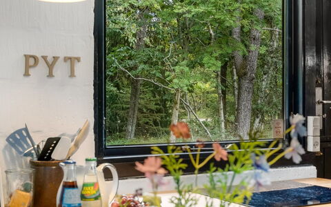 Olaf - 1.4Km from the Sea: Furniture, Glass, Serveware, Houseplant, Flowerpot, Countertop, Kitchen & Dining Room Table, Chair, Kitchen
