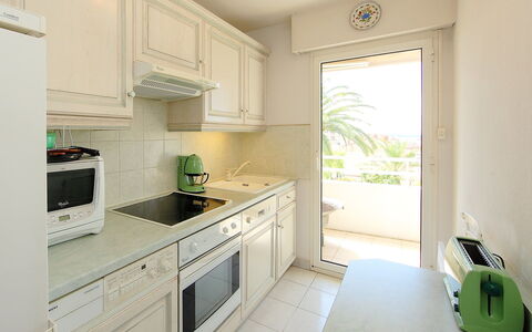 Riviera Park: Property, Room, Green, Furniture, Kitchen, Cabinetry, Building, Interior Design, Yellow, Countertop