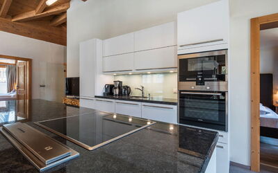 3 Raum Appartement 2A 180.3: Cabinetry, Countertop, Wood, Kitchen, Interior Design, Kitchen Stove, Living Room, Flooring, Floor, Wood Stain