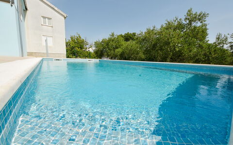 Elena: Water, Sky, Property, Swimming Pool, Building, Azure, Rectangle, Shade, Tree, Cloud