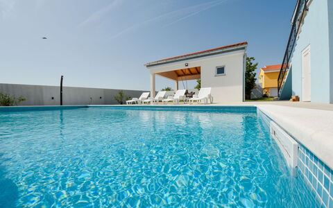 Elena: Water, Sky, Swimming Pool, Cloud, Plant, Azure, Building, Aqua, Leisure, Shade
