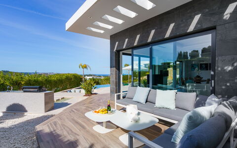 Villa Adonia: Sky, Building, Property, Water, Plant, Azure, Swimming Pool, Architecture, Tree, Condominium