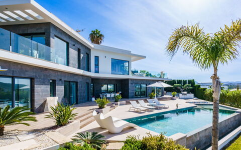 Villa Adonia: Sky, Building, Property, Water, Plant, Azure, Swimming Pool, Architecture, Tree, Condominium