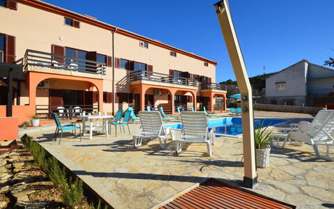 Bilice: Sky, Building, Property, Water, Plant, Azure, Swimming Pool, Architecture, Tree, Condominium
