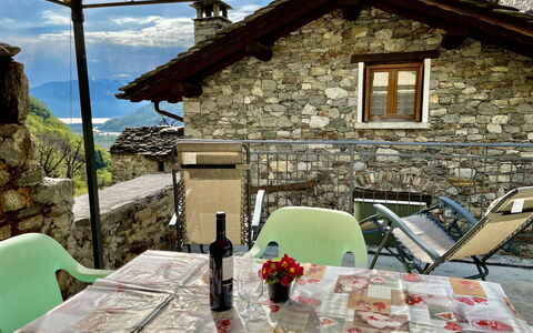Maria: Plant, Table, Furniture, Property, Flowerpot, Building, Houseplant, Shade, Outdoor Furniture, Architecture