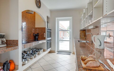 Saga: Interior Design, Flooring, Countertop, Ceiling, Kitchen, Floor, Room, Tile, Cabinetry, Apartment