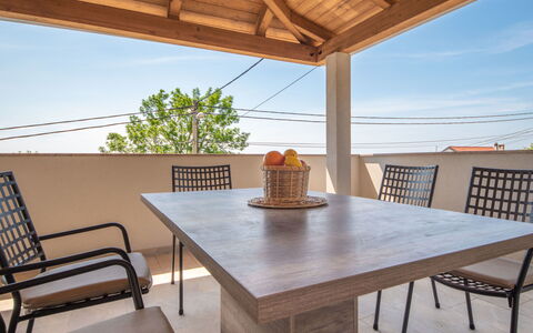 Nola: Table, Sky, Furniture, Property, Wood, Chair, Interior Design, Architecture, Outdoor Furniture, Wood Stain