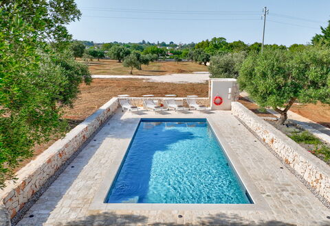 Trullo Under The Apulian Sky: Water, Plant, Property, Sky, Swimming Pool, Azure, Rectangle, Tree, Grass, Body Of Water