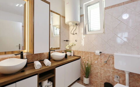 Karlo: Interior Design, Sink, Bathroom Sink, Plumbing Fixture, Flooring, Countertop, Bathroom, Floor, Mirror, Wood