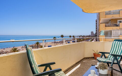 Fuengirola Beach View: Table, Plant, Building, Sky, Cloud, Wood, Porch, Shade, Interior Design, Chair