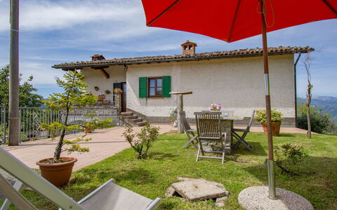 Delle Stelle: Table, Plant, Building, Sky, Cloud, Wood, Porch, Shade, Interior Design, Chair