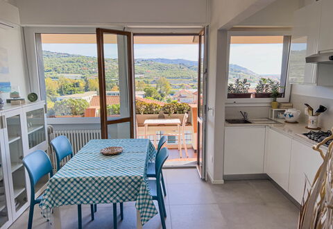 Appartamento La Castellana: Furniture, Property, Chair, Table, Cabinetry, Azure, Countertop, Interior Design, Shade, Wood