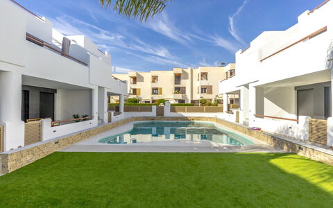 Tropical Beach Penthouse: Sky, Building, Table, Window, Outdoor Furniture, Urban Design, Wood, Shade, Condominium, House