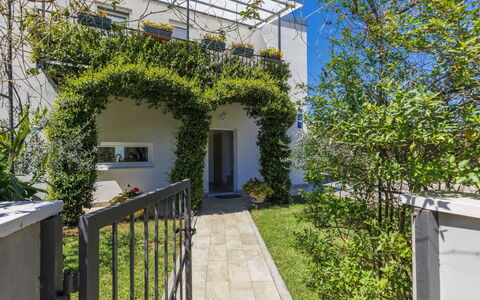 Villa Soši: Sky, Building, Table, Window, Outdoor Furniture, Urban Design, Wood, Shade, Condominium, House
