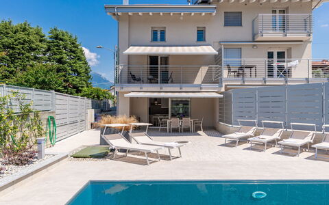 Laghetto: Building, Sky, Property, Plant, Window, Water, Azure, Swimming Pool, Shade, House