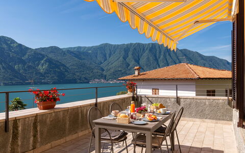 Tremezzina 606: Table, Sky, Property, Mountain, Furniture, Building, Flowerpot, Water, Azure, Outdoor Furniture