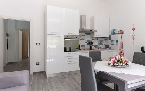Sanda: Furniture, Table, Comfort, Building, Interior Design, Cabinetry, Houseplant, Flooring, Floor, Couch