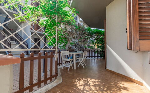 Conero Garden Apartment: Property, Plant, Wood, Interior Design, Chair, Flooring, Wall, Wood Stain, Floor, Real Estate