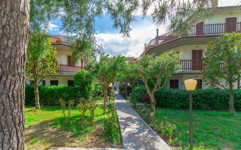 Conero Garden Apartment: Plant, Building, Cloud, Window, Sky, Tree, Land Lot, Vegetation, Urban Design, House