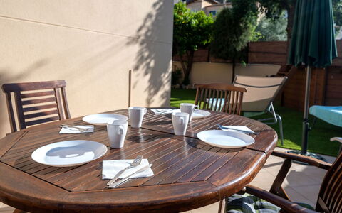 Origin: Table, Furniture, Plant, Sky, Property, Chair, Building, Cloud, Interior Design, Tableware