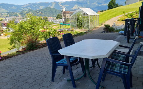 Luxenweid: Plant, Sky, Table, Cloud, Furniture, Property, Flowerpot, Chair, Mountain, Azure