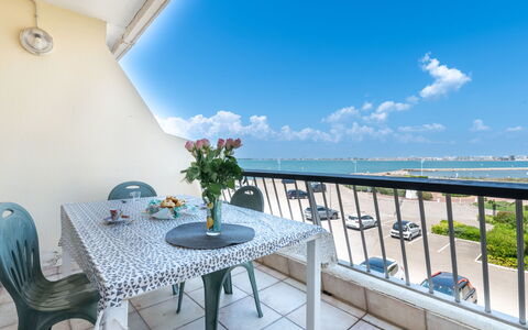 Le Beaupré: Table, Sky, Cloud, Daytime, Property, Furniture, Water, Flower, Blue, Azure