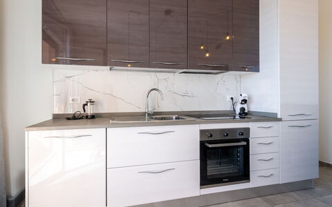 Casa Clio: Cabinetry, Countertop, Kitchen, Flooring, Furniture, Wood, Kitchen Appliance, Drawer, Interior Design, Home
