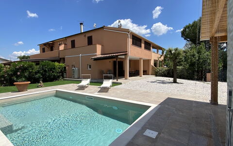 Tuscania: Sky, Building, Water, Cloud, Plant, Daytime, Property, Azure, Swimming Pool, Lighting