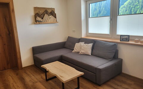 Bergblick: Furniture, Wood, Rectangle, Couch, Interior Design, Floor, Flooring, Picture Frame, Table, Living Room