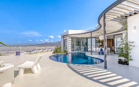 Donut: Water, Sky, Building, Property, Tableware, Window, Seaside Resort, Azure, Table, Architecture