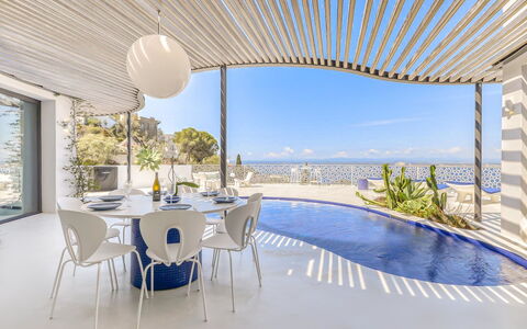 Donut: Water, Sky, Building, Property, Tableware, Window, Seaside Resort, Azure, Table, Architecture