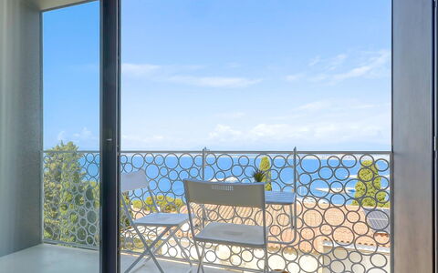 Donut: Water, Sky, Building, Property, Tableware, Window, Seaside Resort, Azure, Table, Architecture
