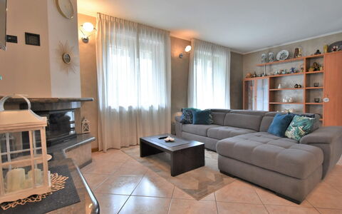 Delebio Terrace Apartment: Cloud, Table, Sky, Furniture, Property, Chair, Building, Water, Outdoor Furniture, Interior Design