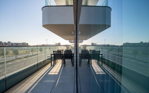 One with Terrace and Dune View: Sky, Urban Design, City, Facade, Symmetry, Building, Road, Composite Material, Metal, Glass