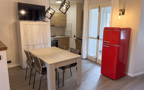 Apartment Tre - Diano Marina: Property, Furniture, Table, Cabinetry, Door, Wood, Kitchen, Window, Flooring, Interior Design