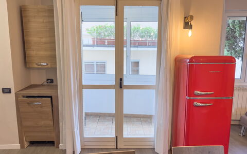 Apartment Tre - Diano Marina: Window, Wood, Cabinetry, Building, Door, Floor, Wood Stain, Flooring